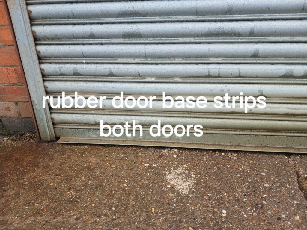 Rubber proofing strip fitted beneath a grain store shutter door to help prevent rats and mice entering